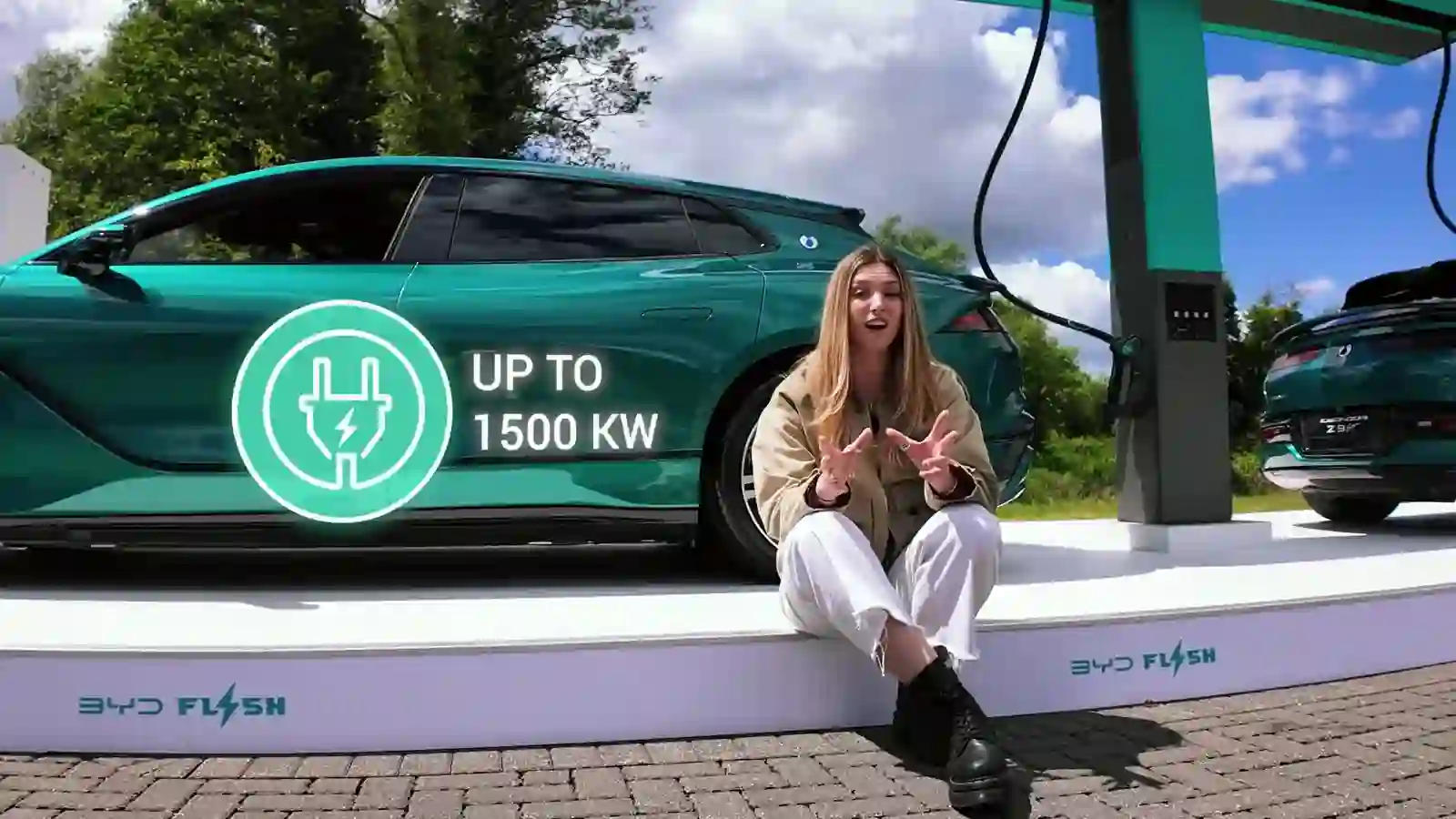 BYD Flash Charging demo with up to 1500 kW signage and presenter at the UK launch