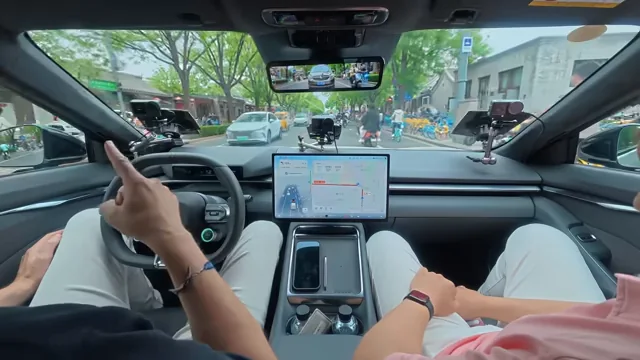 Driver taking over the Xpeng vehicle on a busy city road