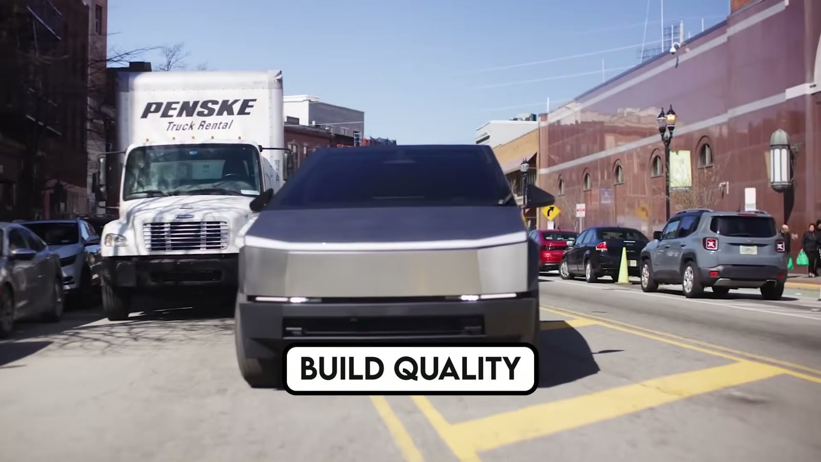 Tesla Cybertruck shown in profile highlighting its stainless-steel angular body