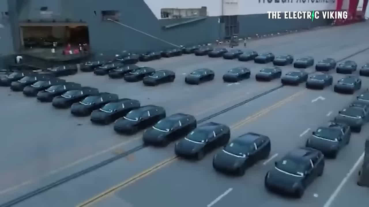 Chinese EVs staged at a port ready for export