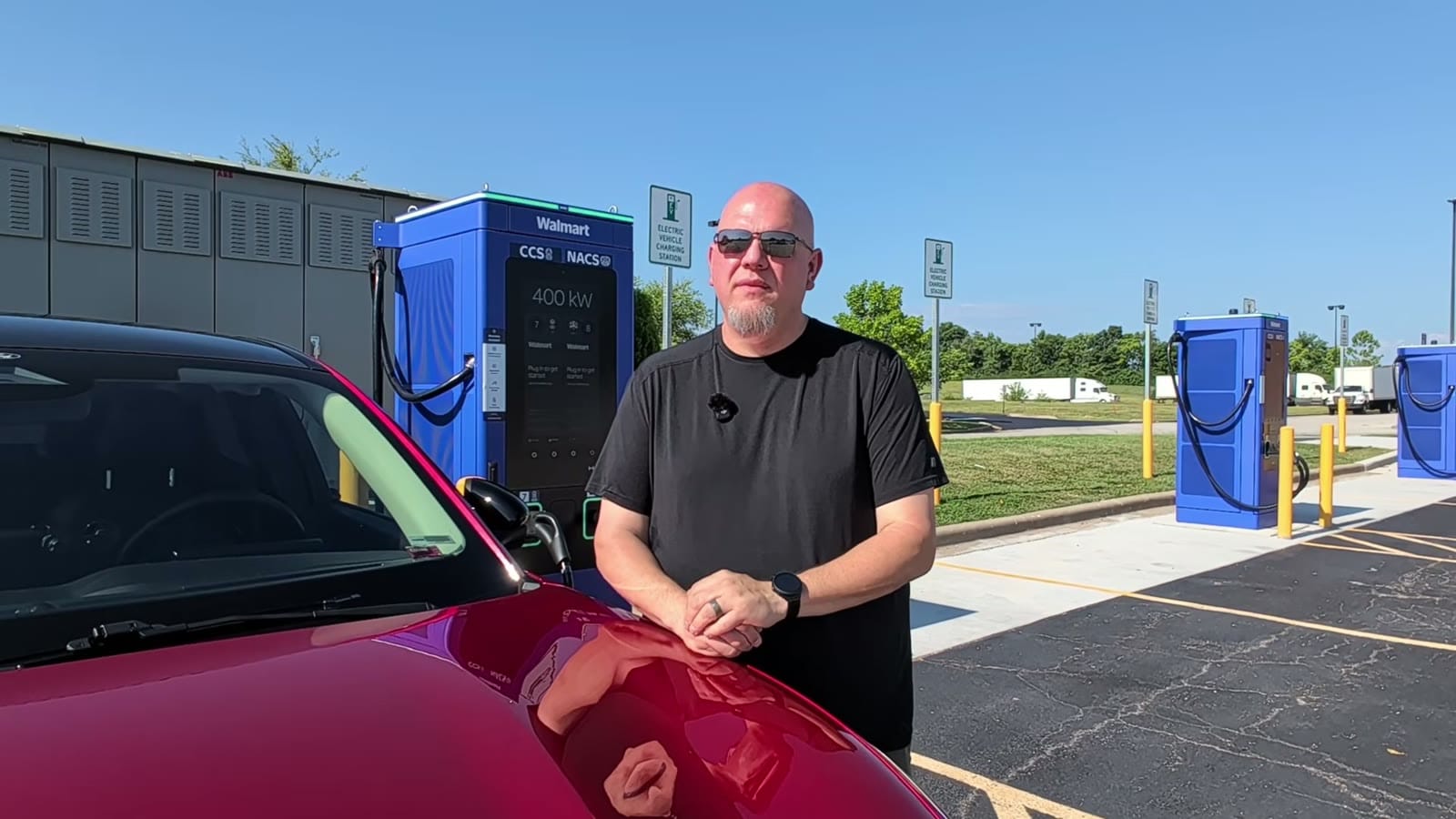 A used electric vehicle on a dealership lot, part of the 2026 off-lease wave flooding the secondary market