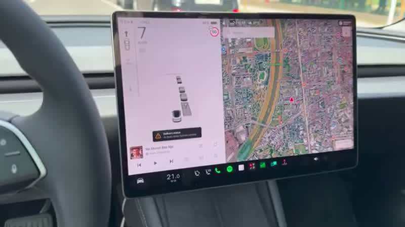 Close-up of Model 3 mirror clearance during automated parking