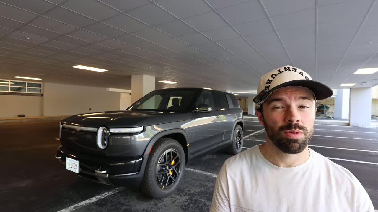 Rivian R2 exterior in Half Moon Gray next to an R1