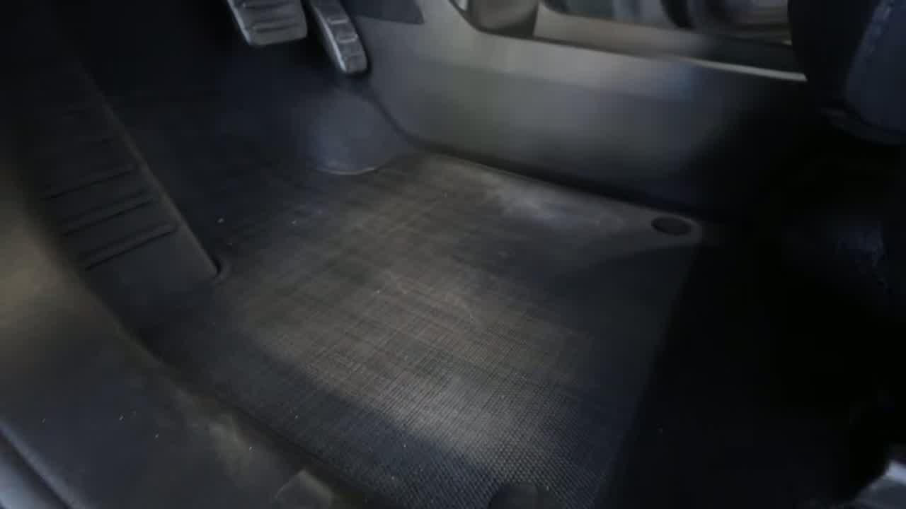 Rivian R2 charge port with NACS connector and maze Easter egg