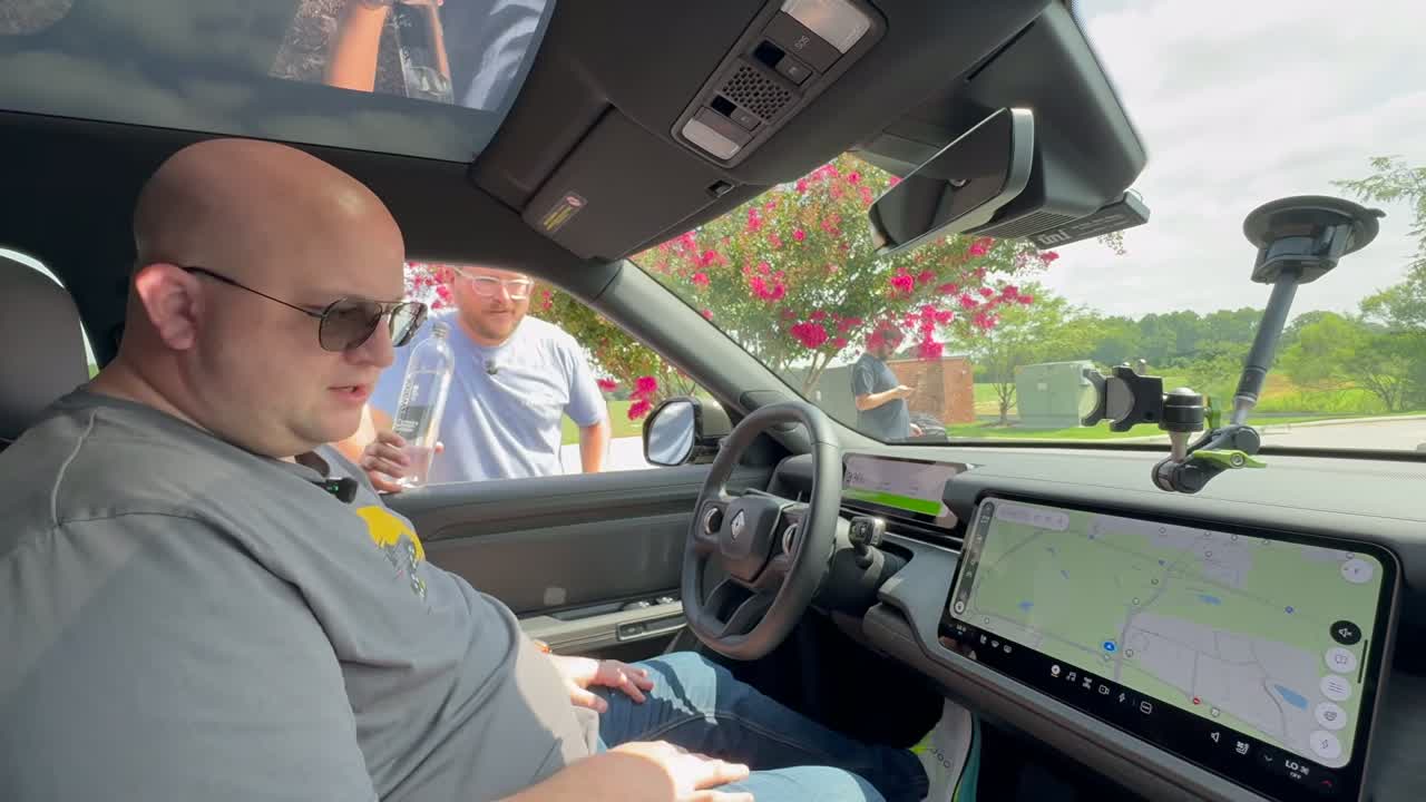On-screen results showing R2 and Model Y range totals
