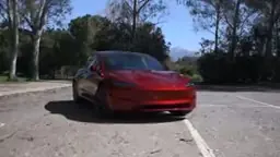 Tesla Cybercab self-driving vehicle operating without steering wheel on public Austin streets
