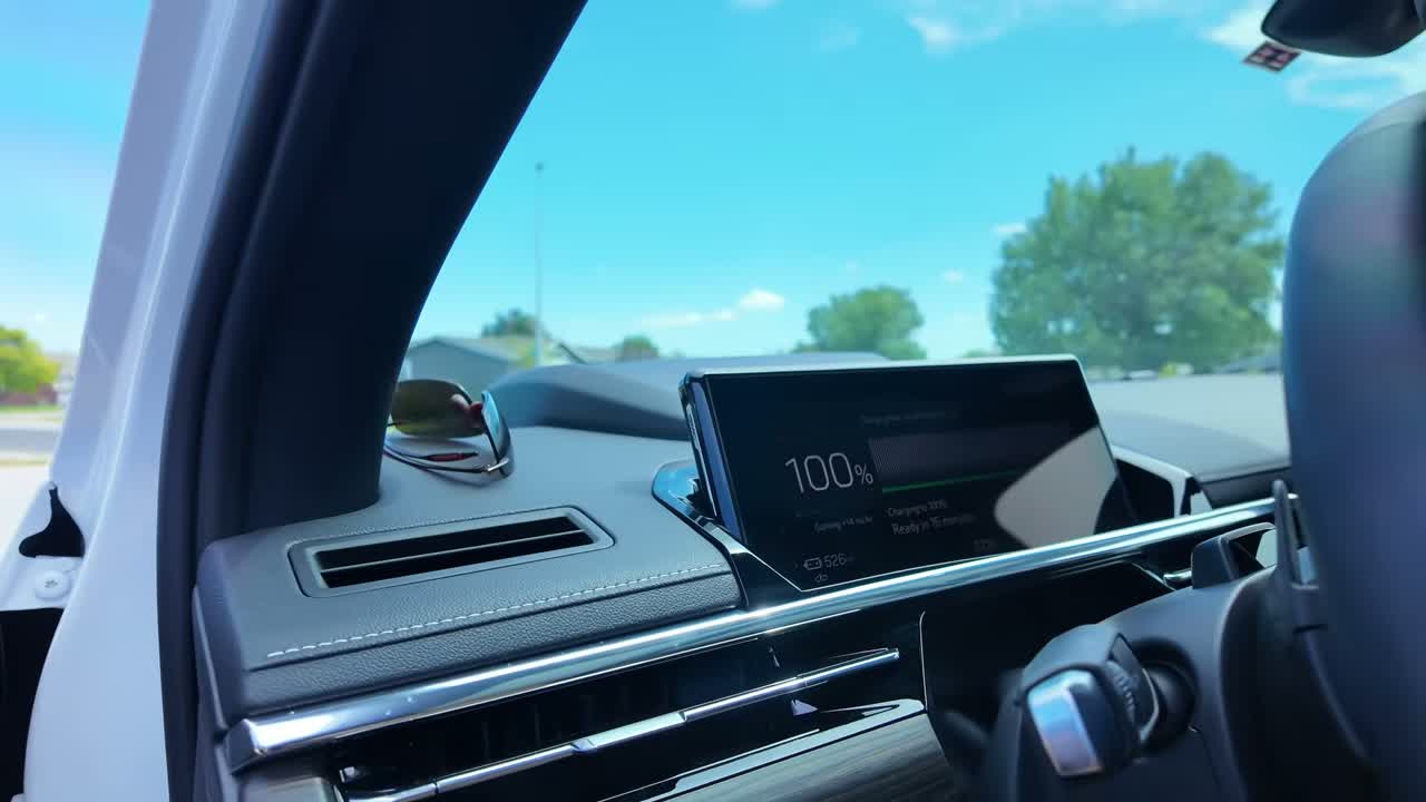 2026 GMC Sierra EV Denali hitched to a 30-foot Keystone Coleman travel trailer