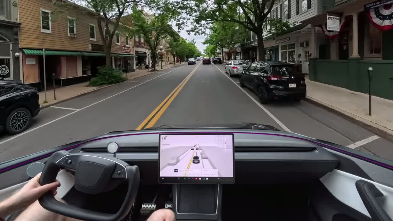 Tesla software update screen showing wave rollout
