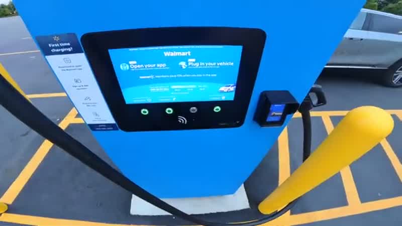Driver charging an EV while shopping at Walmart