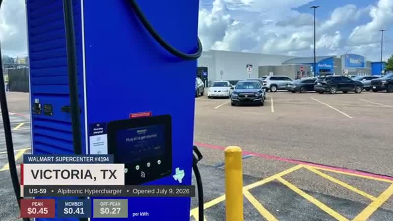 Walmart Supercenter with charging stalls in foreground