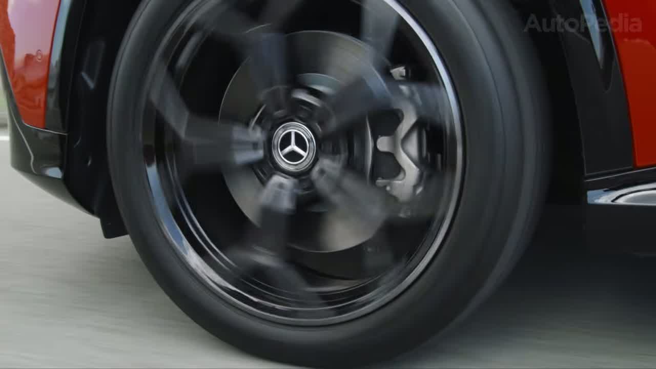 Close-up of a Mercedes-Benz wheel and brake caliper, showcasing the GLA EV's sporty rolling stock.
