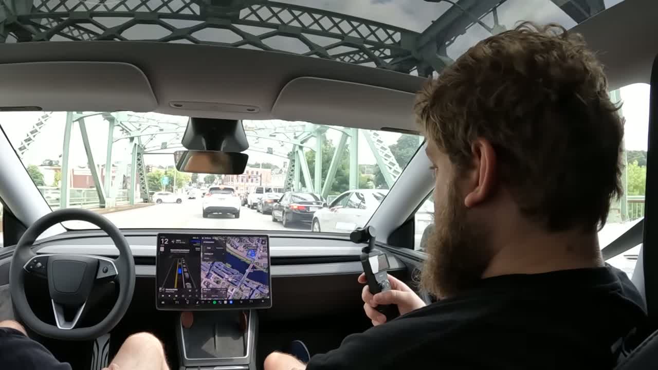 Close-up of the Tesla driving display showing FSD path planning during a tricky maneuver