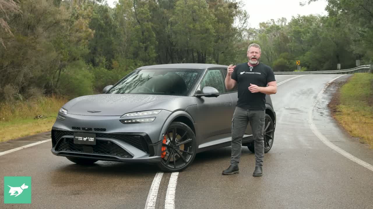 Genesis GV60 Magma front three-quarter in matte finish with aggressive aero