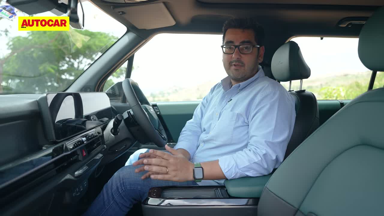 Kia Syros EV interior with 30-inch panoramic display and floating center console