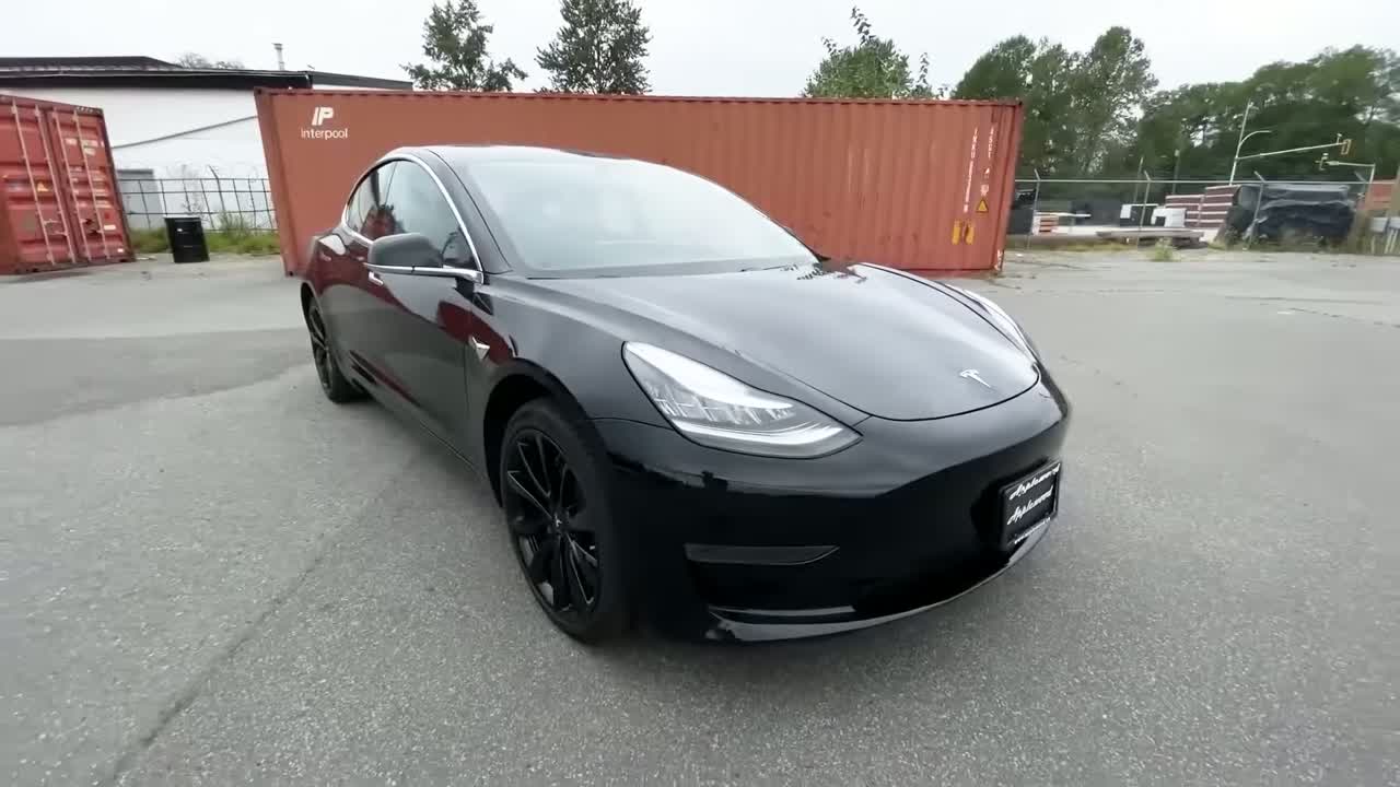 Tesla Model Y in a parking lot — the most reliable EV in CR 2026