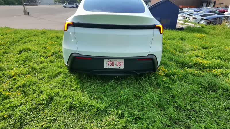 2026 Tesla Model Y Standard interior with cloth seats and 15.4-inch touchscreen