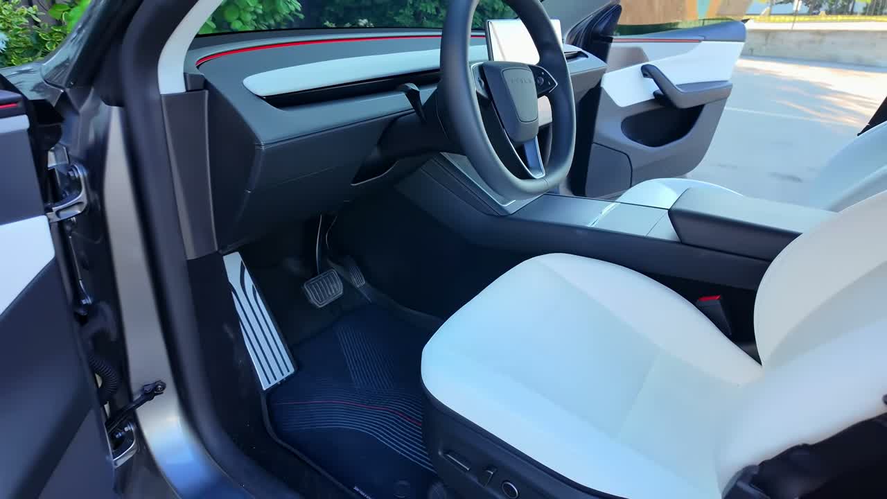 2026 Tesla Model Y Premium panoramic glass roof and rear screen